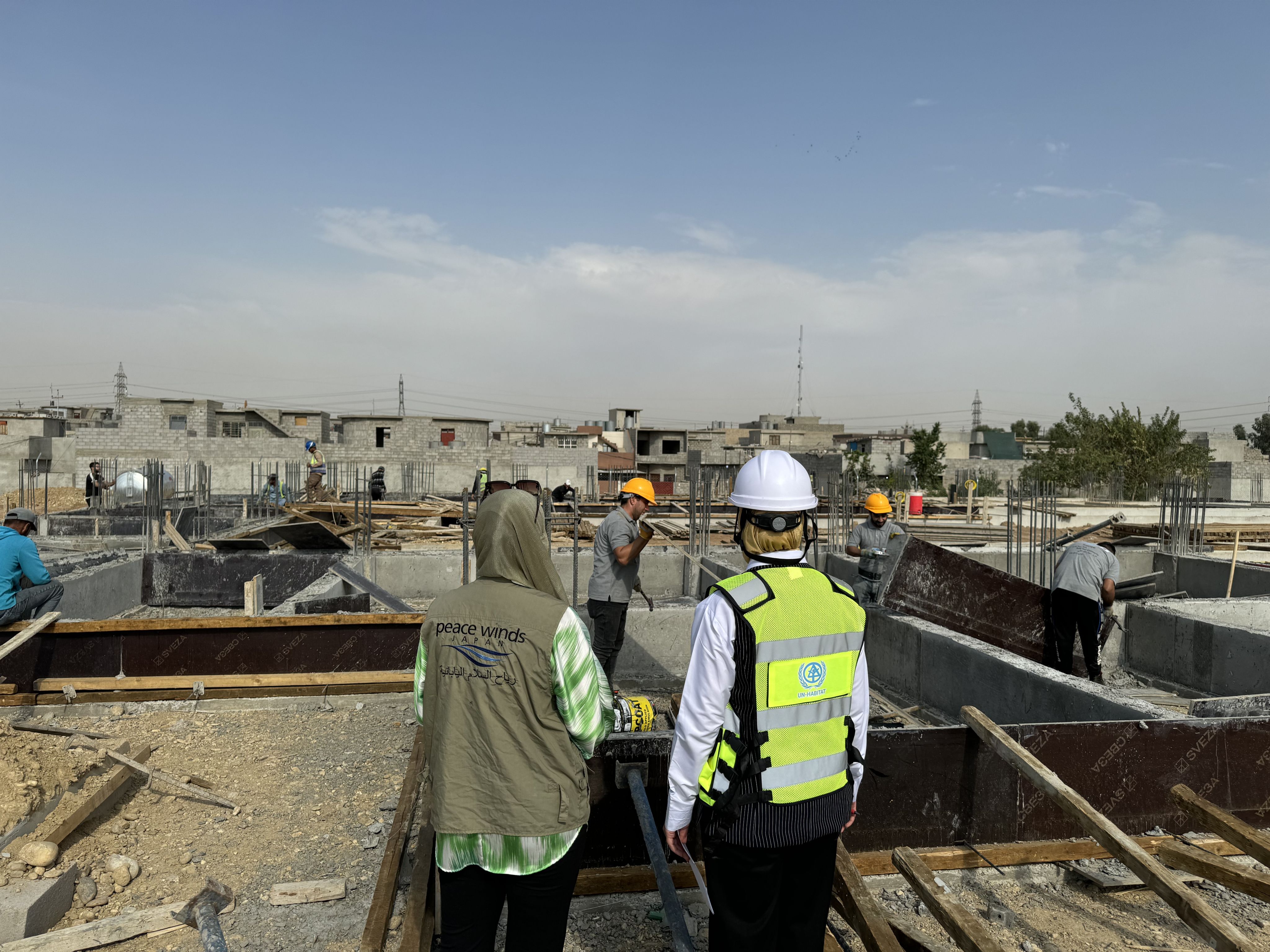 A group of people in hard hats at a construction site
AI-generated content may be incorrect.